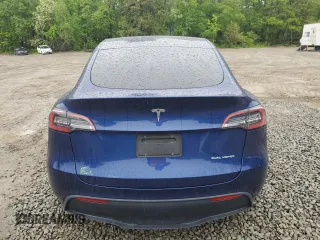 2022 Tesla Model Y Long Range z VIN 7SAYGDEE6NF318808, wystawiony jako Copart lot #57219915 z przebiegiem Nie podano mil oraz Szkoda całkowita • Salvage title. Historia ofert i sprzedaży dostępna na DreamBid. Obrazek 6.