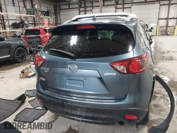 2016 Mazda CX-5 Grand Touring z VIN JM3KE4DY9G0714468, wystawiony jako IAAI lot #41860956 z przebiegiem 114 481 mil mil oraz . Historia ofert i sprzedaży dostępna na DreamBid. Obrazek 16.