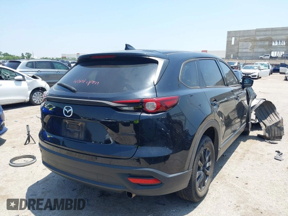 2021 Mazda CX-9 Touring with VIN JM3TCBCY8M0514905, listed as a IAAI auction lot 42385627 with 72,610 mi miles and . Bid and sale history available at DreamBid. Image 4.