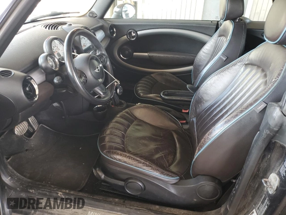 2014 MINI Convertible S with VIN WMWZP3C55ET706573, listed as a Copart auction lot 52325705 with 125,076 mi miles and Salvage Title. Bid and sale history available at DreamBid. Image 7.
