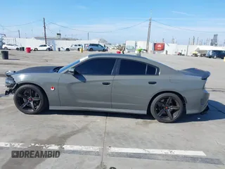 2019 Dodge Charger Scat Pack with VIN 2C3CDXGJ4KH576394, listed as a IAAI auction lot 41846702 with 70,209 mi miles and . Bid and sale history available at DreamBid. Image 14.