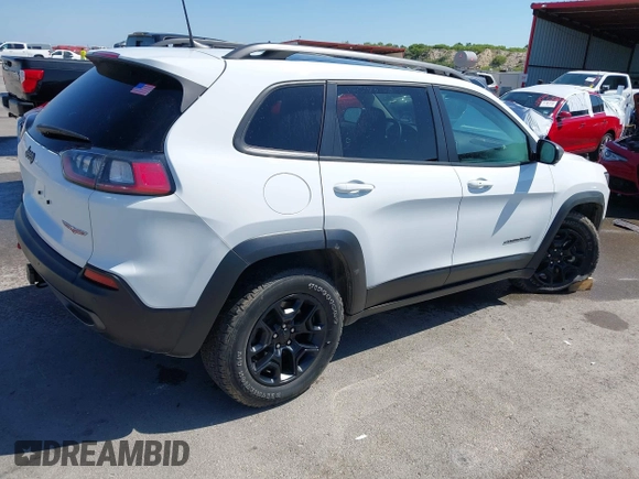 2021 Jeep Cherokee Trailhawk with VIN 1C4PJMBX1MD145169, listed as a IAAI auction lot 42340464 with 50,925 mi miles and . Bid and sale history available at DreamBid. Image 4.