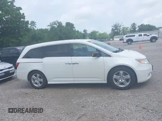 2013 Honda Odyssey Touring with VIN 5FNRL5H9XDB049390, listed as a IAAI auction lot 42532861 with 129,376 mi miles and . Bid and sale history available at DreamBid. Image 14.