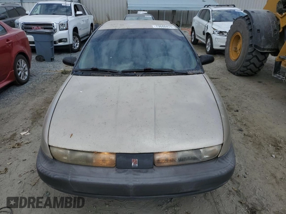 1999 Saturn SL z VIN 1G8ZH5280XZ178863, wystawiony jako Copart lot #73660474 z przebiegiem 195 738 mil mil oraz Szkody całkowita. Historia ofert i sprzedaży dostępna na DreamBid. Obrazek 5.