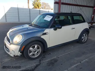 2011 MINI Cooper Hardtop with VIN WMWSU3C57BT251604, listed as a IAAI auction lot 41561611 with 133,618 mi miles. Bid and sale history available at carsss.com. Image 2.