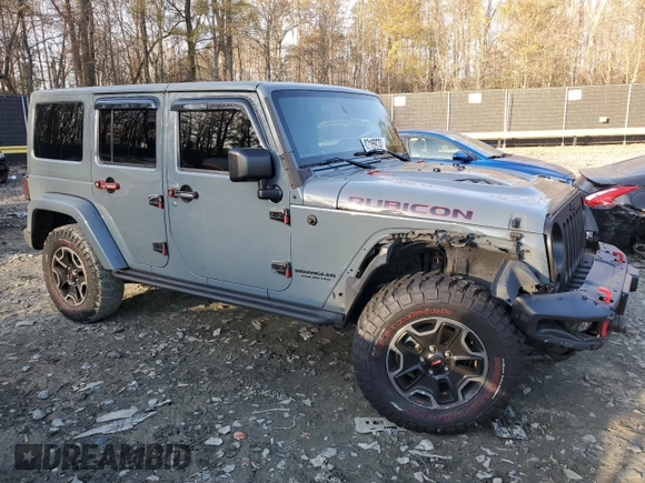 2015 Jeep Wrangler Unlimited Rubicon Hard Rock with VIN 1C4HJWFGXFL671660, listed as a Copart auction lot 82329074 with 214,579 mi miles and Salvage title. Bid and sale history available at DreamBid. Image 4.