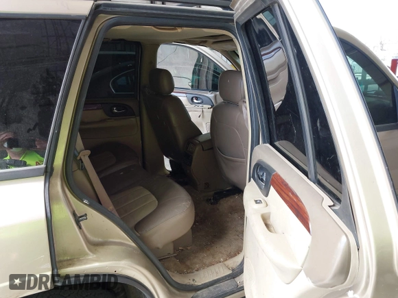 2004 GMC Envoy SLE with VIN 1GKDT13S442136464, listed as a IAAI auction lot 41874304 with 250,330 mi miles. Bid and sale history available at carsss.com. Image 8.