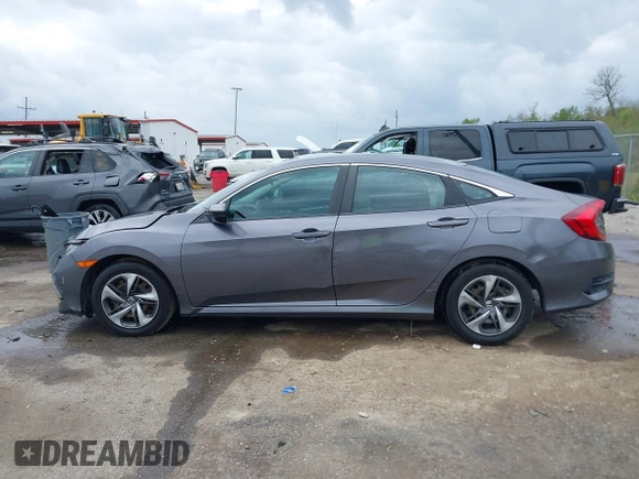 2019 Honda Civic LX with VIN 19XFC2F68KE007409, listed as a IAAI auction lot 41887406 with 57,147 mi miles and . Bid and sale history available at DreamBid. Image 14.
