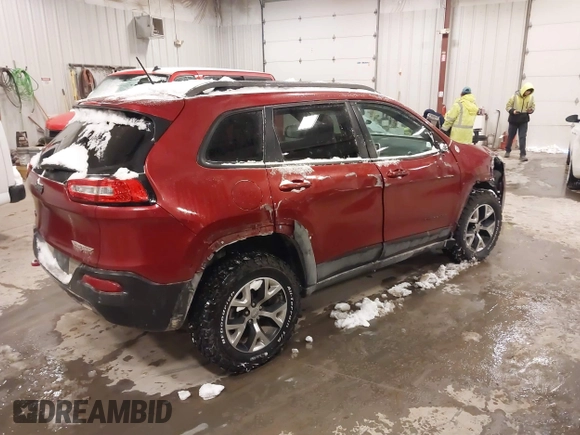 2015 Jeep Cherokee Trailhawk with VIN 1C4PJMBS2FW609999, listed as a IAAI auction lot 41582536 with 133,666 mi miles. Bid and sale history available at carsss.com. Image 4.