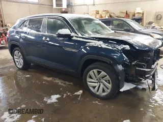 2022 Volkswagen Atlas SE z VIN 1V2HE2CA6NC219084, wystawiony jako IAAI lot #41298004 z przebiegiem 64 411 mil mil oraz . Historia ofert i sprzedaży dostępna na DreamBid. Obrazek 1.
