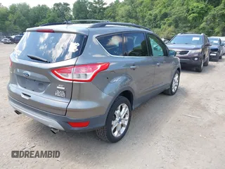 2013 Ford Escape SE with VIN 1FMCU9GXXDUA97162, listed as a IAAI auction lot 42633382 with 74,375 mi miles and . Bid and sale history available at DreamBid. Image 4.