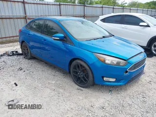 2016 Ford Focus SE z VIN 1FADP3FE2GL211832, wystawiony jako IAAI lot #42250695 z przebiegiem 116 656 mil mil oraz . Historia ofert i sprzedaży dostępna na DreamBid. Obrazek 1.
