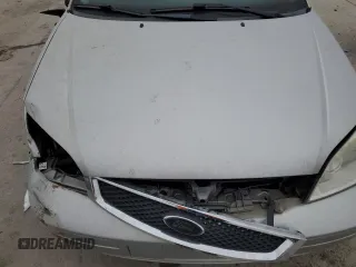 2006 Ford Focus S z VIN 1FAFP31N76W169137, wystawiony jako Copart lot #43445245 z przebiegiem 100 323 mil mil oraz Czysty tytuł • Clean title. Historia ofert i sprzedaży dostępna na DreamBid. Obrazek 13.