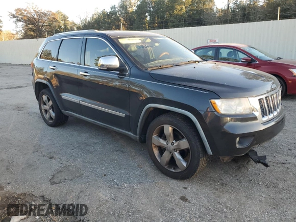 2011 Jeep Grand Cherokee Overland with VIN 1J4RS6GG0BC557302, listed as a Copart auction lot 83851734 with 195,443 mi miles and Salvage Title. Bid and sale history available at DreamBid. Image 4.