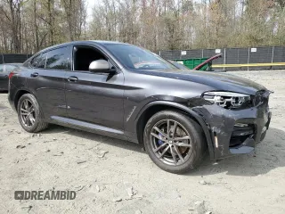 2019 BMW X4 M40i with VIN 5UXUJ5C5XKLJ64004, listed as a Copart auction lot 52106895 with 74,599 mi miles and Salvage title. Bid and sale history available at DreamBid. Image 4.