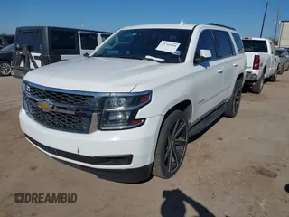 2015 Chevrolet Tahoe LS with VIN 1GNSCAKCXFR748554, listed as a IAAI auction lot 41765865 with 160,282 mi miles and . Bid and sale history available at DreamBid. Image 2.