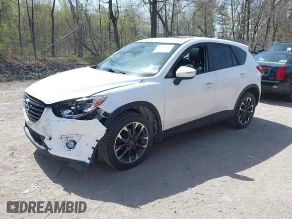 2016 Mazda CX-5 Grand Touring with VIN JM3KE4DY0G0632693, listed as a IAAI auction lot 42123142 with 106,592 mi miles. Bid and sale history available at carsss.com. Image 2.