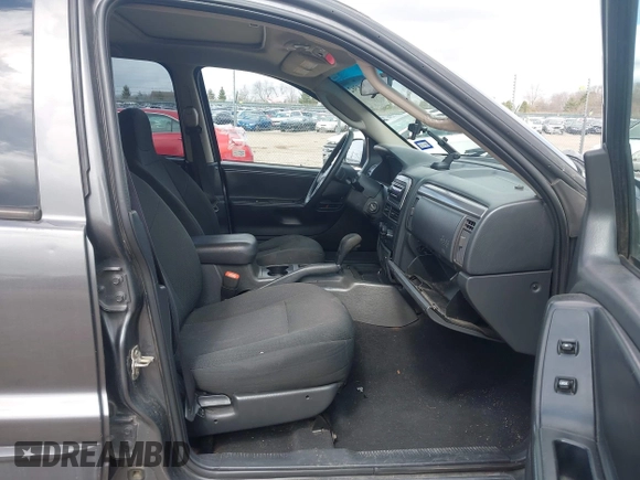 2004 Jeep Grand Cherokee Laredo z VIN 1J4GW48SX4C213322, wystawiony jako IAAI lot #41969362 z przebiegiem 273 876 mil mil oraz . Historia ofert i sprzedaży dostępna na DreamBid. Obrazek 5.