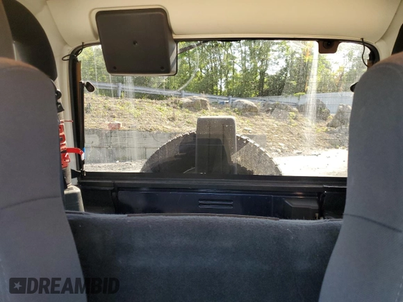 2003 Jeep Wrangler Sport z VIN 1J4FA49S13P347815, wystawiony jako Copart lot #59536685 z przebiegiem 74 298 mil mil oraz Szkoda całkowita • Salvage title. Historia ofert i sprzedaży dostępna na DreamBid. Obrazek 10.