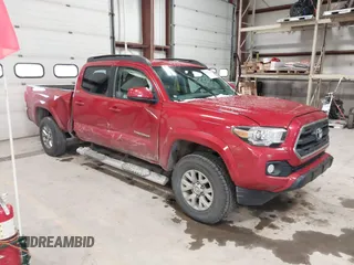 2017 Toyota Tacoma SR5 with VIN 5TFDZ5BN8HX018651, listed as a IAAI auction lot 41239996 with 124,418 mi miles. Bid and sale history available at carsss.com. Image 1.