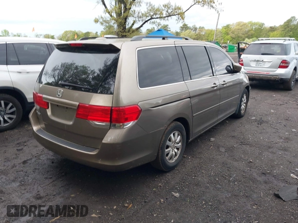 2009 Honda Odyssey EX-L with VIN 5FNRL38759B022866, listed as a IAAI auction lot 42200965 with 145,641 mi miles and . Bid and sale history available at DreamBid. Image 4.