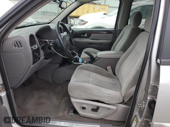 2005 GMC Envoy SLT with VIN 1GKDS13S452258553, listed as a Copart auction lot 82888944 with 174,546 mi miles and Salvage Title. Bid and sale history available at carsss.com. Image 7.