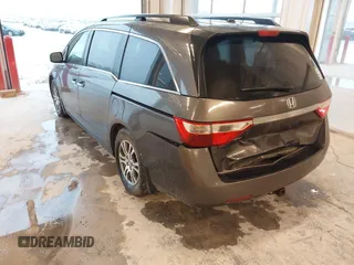 2012 Honda Odyssey EX-L with VIN 5FNRL5H66CB127507, listed as a IAAI auction lot 41961465 with 228,972 mi miles and . Bid and sale history available at carsss.com. Image 3.