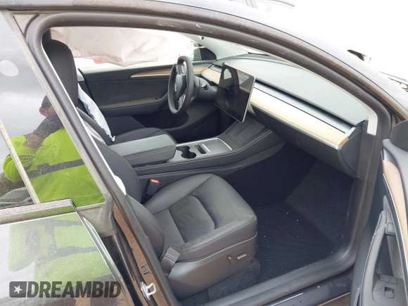 2024 Tesla Model Y with VIN 7SAYGDED3RA303113, listed as a IAAI auction lot 41915760 with 12,917 mi miles and . Bid and sale history available at DreamBid. Image 5.