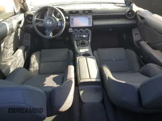 2024 Toyota GR86 with VIN JF1ZNBB15R8755014, listed as a Copart auction lot 76839334 with 2,560 mi miles and Salvage Title. Bid and sale history available at carsss.com. Image 8.