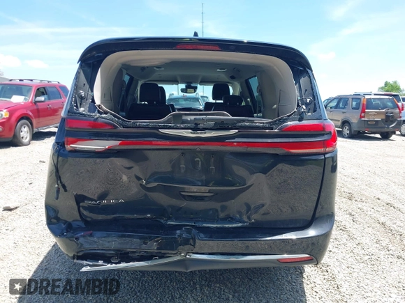 2023 Chrysler Pacifica Touring L with VIN 2C4RC1BG1PR606504, listed as a IAAI auction lot 42647652 with 41,598 mi miles and . Bid and sale history available at DreamBid. Image 17.
