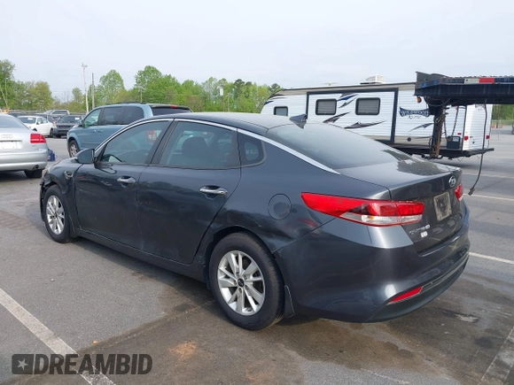2016 Kia Optima LX with VIN KNAGT4L33G5107444, listed as a IAAI auction lot 41971006 with 174,997 mi miles. Bid and sale history available at carsss.com. Image 3.