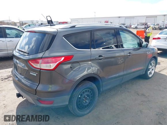 2015 Ford Escape Titanium with VIN 1FMCU0J91FUB74896, listed as a IAAI auction lot 41919609 with 135,363 mi miles. Bid and sale history available at carsss.com. Image 4.