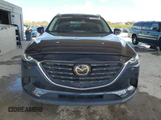 2022 Mazda CX-9 Touring Plus with VIN JM3TCBAYXN0607056, listed as a Copart auction lot 61740065 with 59,281 mi miles and Salvage title. Bid and sale history available at DreamBid. Image 5.