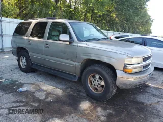 2000 Chevrolet Tahoe LS with VIN 1GNEK13T2YJ203710, listed as a Copart auction lot 57302495 with 237,227 mi miles and Salvage title. Bid and sale history available at DreamBid. Image 4.
