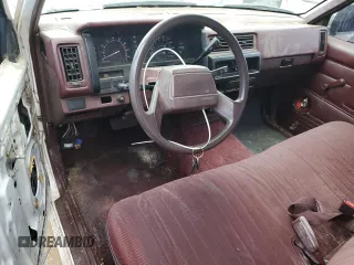 1990 Nissan Frontier z VIN 1N6SD11S8LC377906, wystawiony jako Copart lot #54840925 z przebiegiem 131 024 mil mil oraz Szkody całkowita. Historia ofert i sprzedaży dostępna na DreamBid. Obrazek 8.