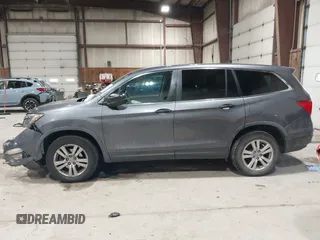 2016 Honda Pilot LX with VIN 5FNYF6H1XGB111488, listed as a IAAI auction lot 41581706 with 100,028 mi miles. Bid and sale history available at carsss.com. Image 14.