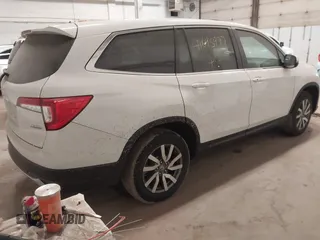 2022 Honda Pilot EX-L with VIN 5FNYF6H59NB097809, listed as a IAAI auction lot 41695977 with 22,800 mi miles. Bid and sale history available at carsss.com. Image 4.