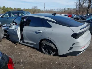 2023 Kia K5 GT-Line z VIN 5XXG64J28PG188506, wystawiony jako IAAI lot #41854184 z przebiegiem 18 967 mil mil oraz . Historia ofert i sprzedaży dostępna na DreamBid. Obrazek 3.