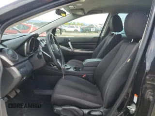 2011 Mazda CX-7 i SV z VIN JM3ER2AMXB0396845, wystawiony jako Copart lot #52347865 z przebiegiem 171 487 mil mil oraz Szkoda całkowita • Salvage title. Historia ofert i sprzedaży dostępna na DreamBid. Obrazek 7.