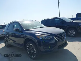 2016 Mazda CX-5 Grand Touring z VIN JM3KE2DY3G0797321, wystawiony jako IAAI lot #42017174 z przebiegiem 65 505 mil mil oraz . Historia ofert i sprzedaży dostępna na DreamBid. Obrazek 13.