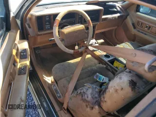 1990 Cadillac Eldorado z VIN 1G6EL1334LU616468, wystawiony jako Copart lot #76398934 z przebiegiem Nie podano mil oraz Szkody całkowita. Historia ofert i sprzedaży dostępna na DreamBid. Obrazek 8.