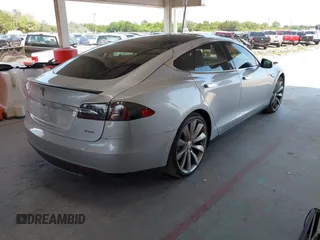 2013 Tesla Model S Performance with VIN 5YJSA1DP6DFP07999, listed as a IAAI auction lot 42284612 with 123,261 mi miles and . Bid and sale history available at DreamBid. Image 4.