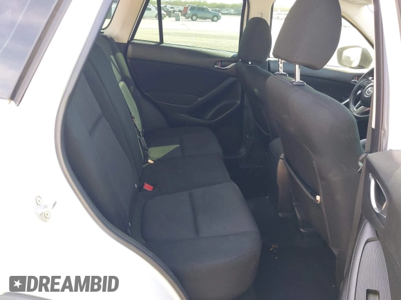 2013 Mazda CX-5 Sport z VIN JM3KE2BE5D0135213, wystawiony jako IAAI lot #42270730 z przebiegiem 140 917 mil mil oraz . Historia ofert i sprzedaży dostępna na DreamBid. Obrazek 8.