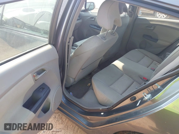 2010 Honda Insight EX with VIN JHMZE2H74AS027020, listed as a IAAI auction lot 42394875 with 248,003 mi miles and . Bid and sale history available at DreamBid. Image 8.