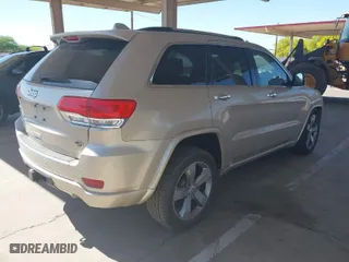 2014 Jeep Grand Cherokee Overland with VIN 1C4RJFCT4EC400565, listed as a IAAI auction lot 41937436 with 56,481 mi miles. Bid and sale history available at carsss.com. Image 4.