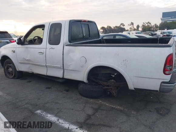 1999 Ford F-150 XL with VIN 1FTRX18L1XKB61205, listed as a IAAI auction lot 40991236 with 178,889 mi miles. Bid and sale history available at carsss.com. Image 14.