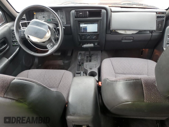 1999 Jeep Cherokee Sport with VIN 1J4FF68S7XL560943, listed as a Copart auction lot 58425505 with 68,654 mi miles and Salvage title. Bid and sale history available at DreamBid. Image 8.