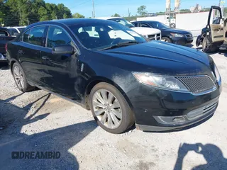 2013 Lincoln MKS EcoBoost with VIN 1LNHL9FT5DG608587, listed as a IAAI auction lot 42737346 with 141,179 mi miles and . Bid and sale history available at DreamBid. Image 1.