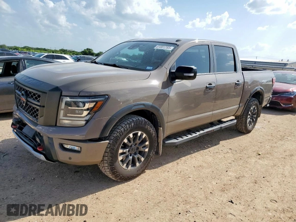 2021 Nissan Titan Pro-4X with VIN 1N6AA1EDXMN523826, listed as a Copart auction lot 61851765 with 85,783 mi miles and Salvage title. Bid and sale history available at DreamBid. Image 1.