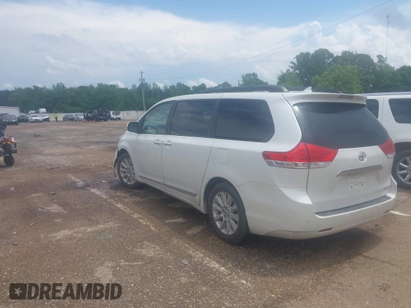2014 Toyota Sienna XLE with VIN 5TDYK3DC2ES517663, listed as a IAAI auction lot 42171862 with 143,447 mi miles and . Bid and sale history available at DreamBid. Image 3.